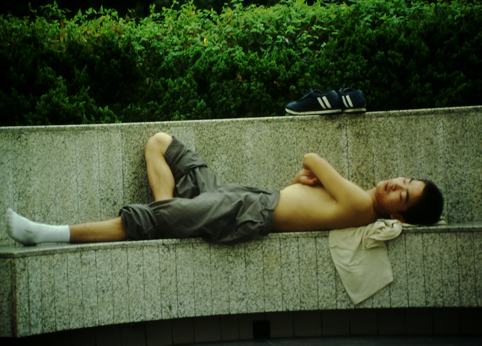 In China, napping on a bench is an artform. This is how to nap like a boss.